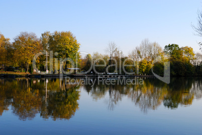 Forest moorage and its reflection in Nekar river