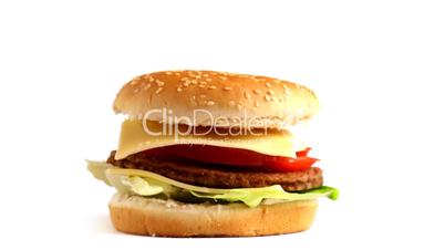 Rotating Tasty hamburger on white background, loopable