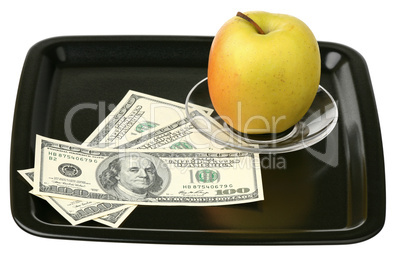 US dollars and yellow apple