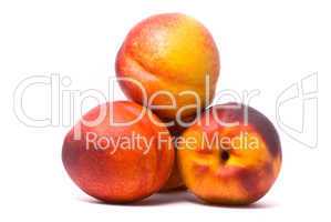 Juicy nectarines on a white background