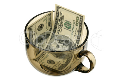 Dollars in a glass cup