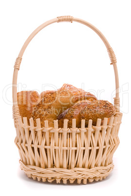 Fresh buns in a basket on a white background