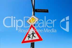 Priority road and children crossing road signs