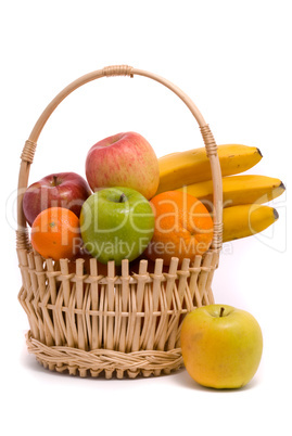 Basket with colorful fruits on a white background