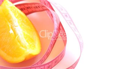 Tape measure wrapped around rotating orange, loopable