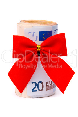 Roll of Euro money and red bow isolated on white background