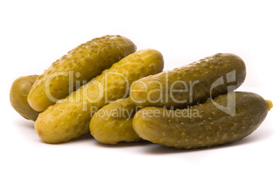 Salted cucumbers on a white background