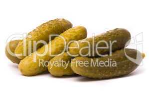 Salted cucumbers on a white background