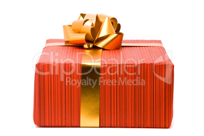 Red gift box with golden bow on a white background Red gift box with golden bow on a white background