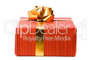 Red gift box with golden bow on a white background