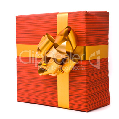 Red gift box with golden bow on a white background Red gift box with golden bow on a white background