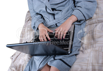 The girl in a dressing gown with the laptop