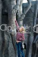 The girl near a sculpture