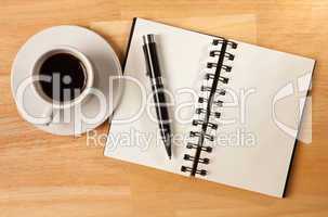 Blank Spiral Note Pad, Cup and Pen on Wood