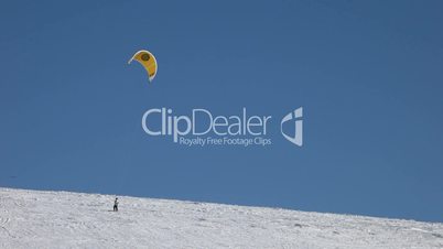 Snowkite on mountain ridge