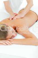 Happy woman enjoying a massage