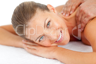 Portrait of smiling woman enjoying a massage