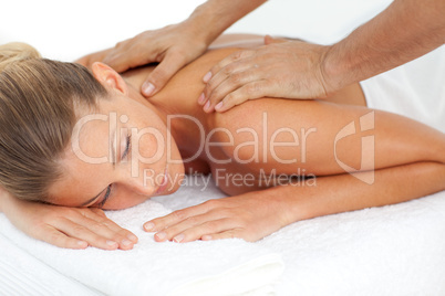 Blond woman enjoying a massage
