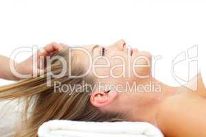 Attractive woman enjoying a head massage
