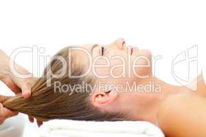 Relaxed woman enjoying a hair massage