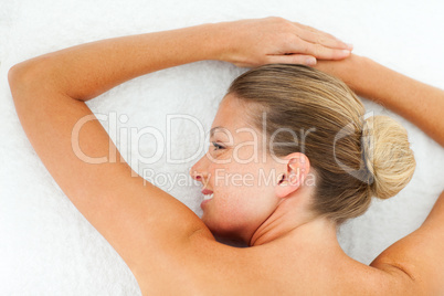 Smiling woman relaxing after spa treatment