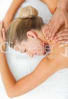 Cheerful woman enjoying a massage