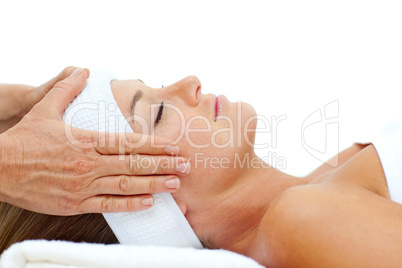 Attractive woman relaxing with head massage
