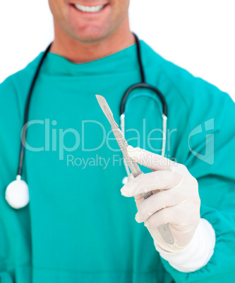 Close-up of surgeon holding a scalpel