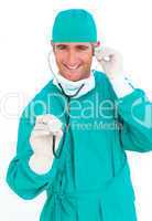 Smiling surgeon holding a stethoscope