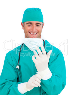 Attractive surgeon wearing surgical gloves
