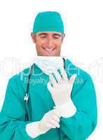 Attractive surgeon wearing surgical gloves