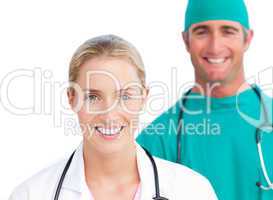 Blond female doctor and smiling surgeon