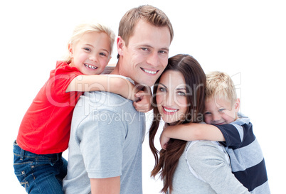 Portrait of joyful family enjoying piggyback ride against a whit