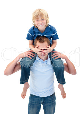 Cheerful father giving his son piggyback ride