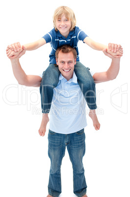 Smiling father giving his son piggyback ride