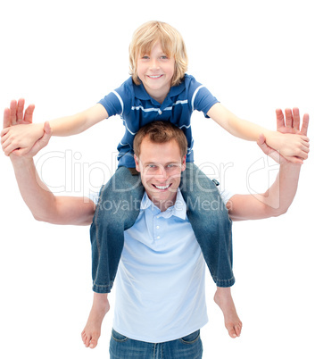 Charming father giving his son piggyback ride