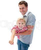 Cute little girl enjoying piggyback ride with her father