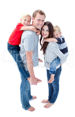 Merry family enjoying piggyback ride