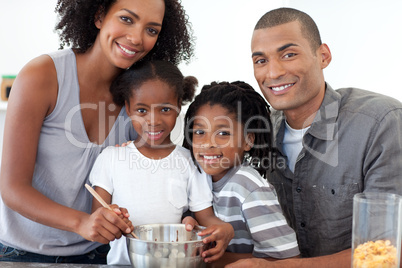 Cheerful family making cookies together
