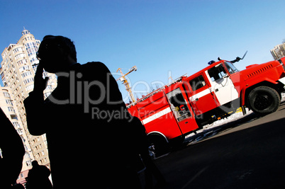 Man smoking in front of fire truck