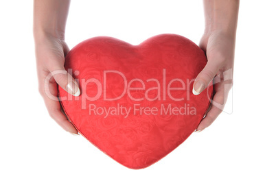 Red heart in female hands