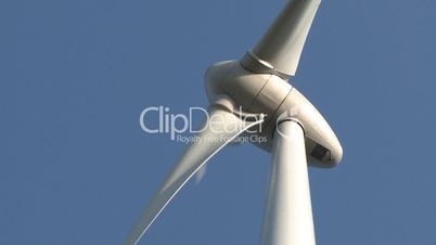 Wind turbine on blue sky