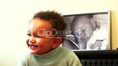 Young black baby girl laughing