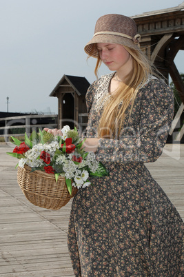 Girl with basket of flowers