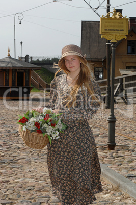 Girl with basket of flowers