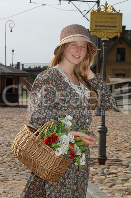 Girl with basket of flowers