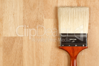 Paint Brush on Wood Surface