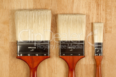 Paint Brushes on Wood Surface