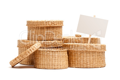 Various Sized Wicker Baskets with Blank Sign on White