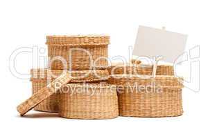Various Sized Wicker Baskets with Blank Sign on White